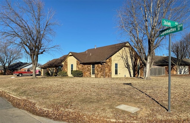 single story home with stone siding