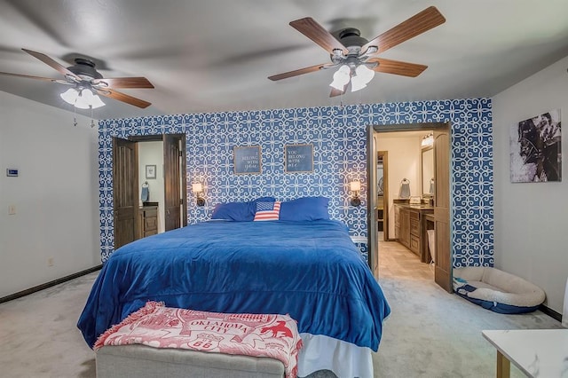 bedroom featuring ceiling fan, carpet floors, and ensuite bath