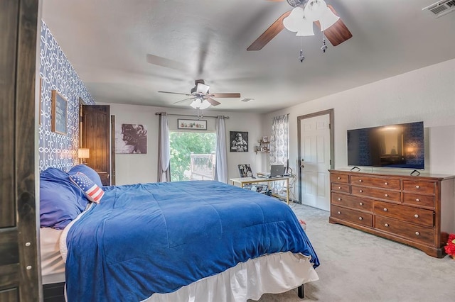 bedroom featuring ceiling fan and light carpet