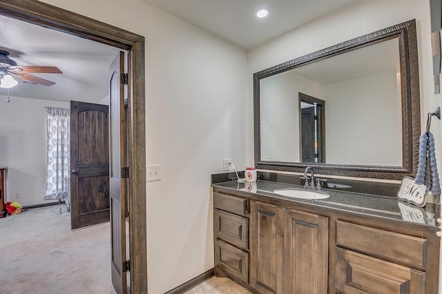 bathroom with ceiling fan and vanity