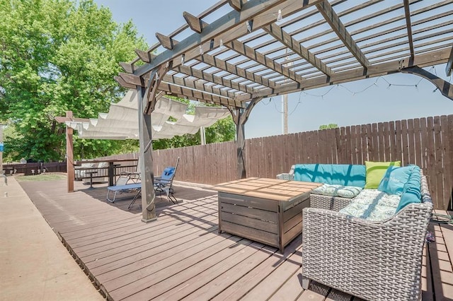 deck with an outdoor hangout area and a pergola