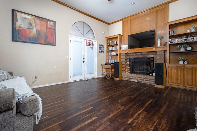 living room featuring dark wood-type flooring, ornamental molding, and a fireplace