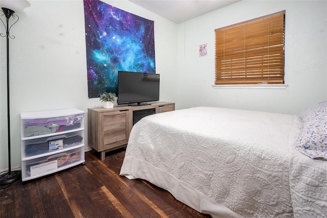 bedroom featuring dark hardwood / wood-style flooring