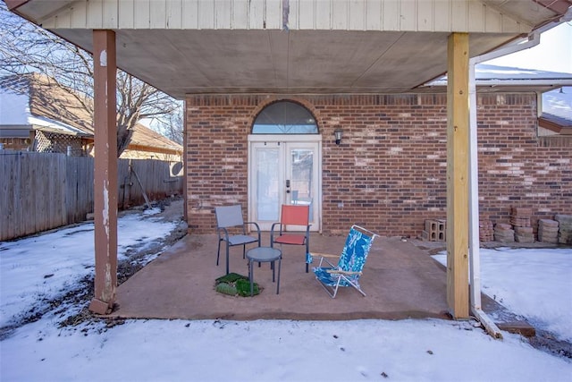 view of snow covered patio