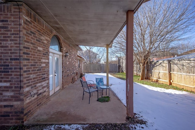 view of snow covered patio