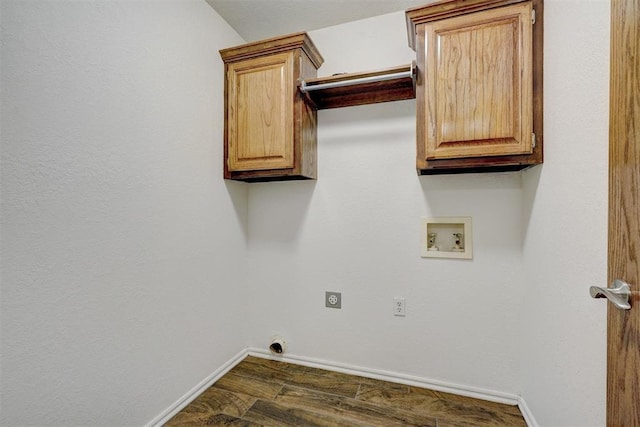 clothes washing area featuring dark hardwood / wood-style floors, washer hookup, electric dryer hookup, and cabinets