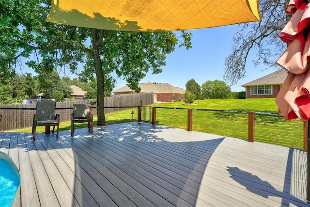 wooden terrace with a yard