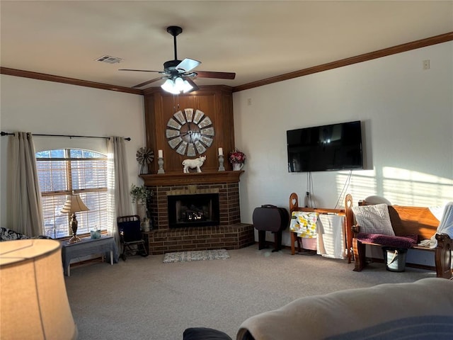 carpeted living room with ceiling fan, a fireplace, and ornamental molding