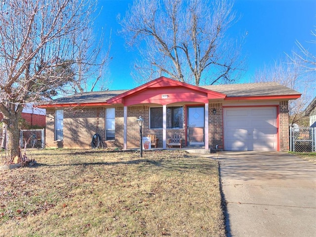 ranch-style home with a front yard and a garage