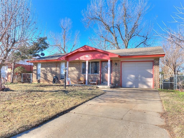 ranch-style house featuring a garage, a front yard, and a porch