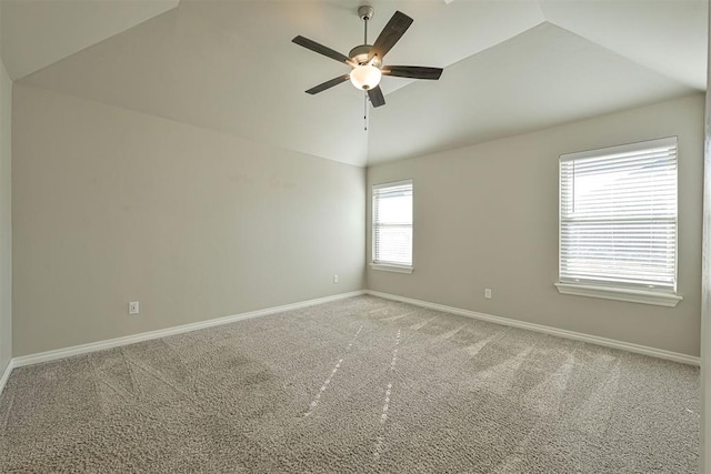 unfurnished room with lofted ceiling, carpet floors, and ceiling fan