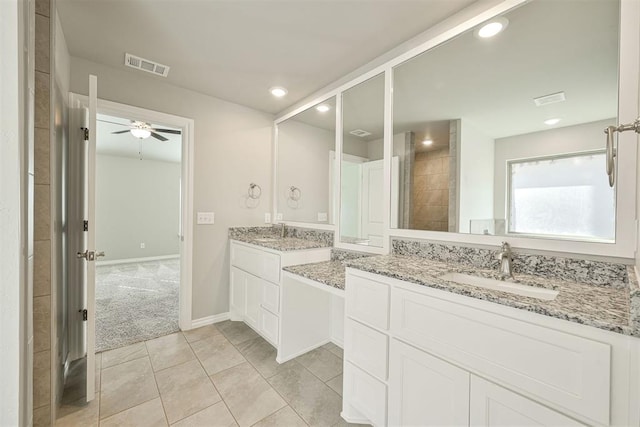 bathroom featuring tile patterned flooring, vanity, and ceiling fan