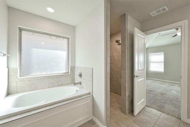 bathroom with tile patterned flooring, separate shower and tub, and ceiling fan