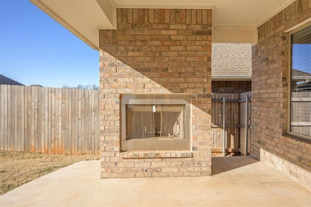 view of patio / terrace with an outdoor fireplace