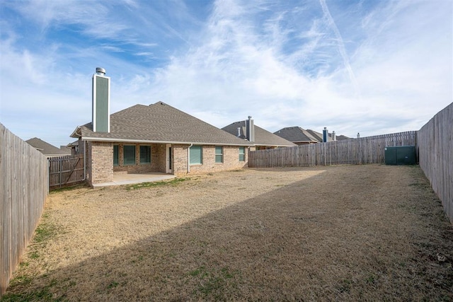 rear view of property featuring a patio