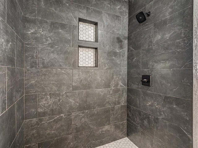 bathroom featuring tiled shower