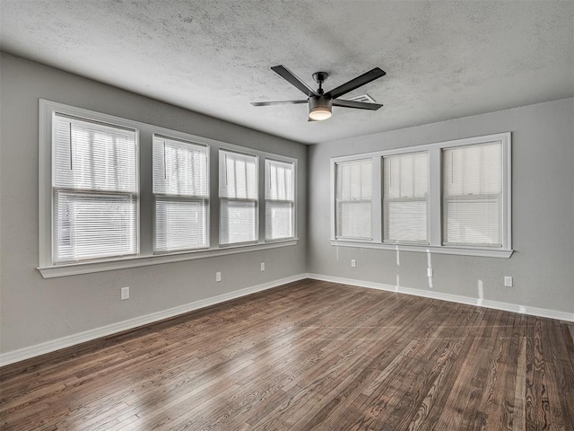 unfurnished room with a textured ceiling, ceiling fan, and dark hardwood / wood-style floors