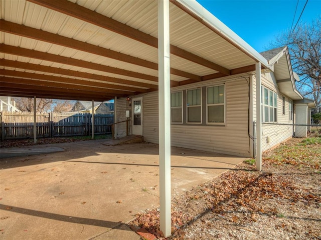 view of property exterior featuring a carport