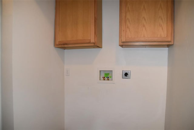 laundry room featuring cabinets, hookup for a washing machine, and electric dryer hookup