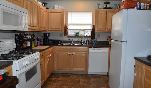 kitchen featuring sink and white appliances