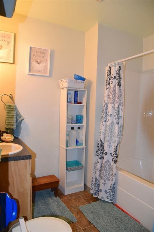 full bathroom with toilet, vanity, and shower / bath combo with shower curtain