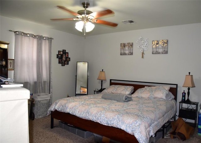 bedroom featuring ceiling fan and carpet