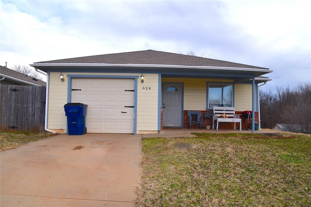 ranch-style house featuring covered porch, a front lawn, and a garage