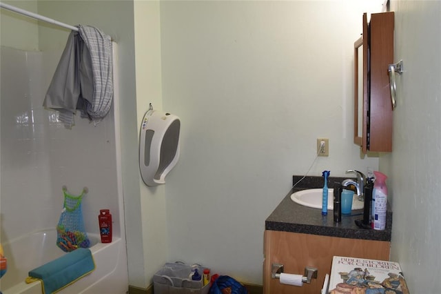 bathroom featuring vanity and shower / bath combo with shower curtain