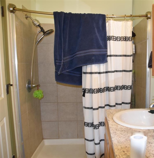 bathroom with vanity and a shower with shower curtain