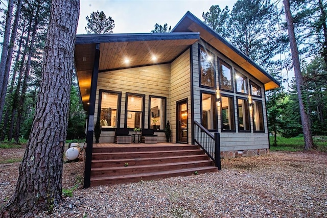 rear view of property featuring crawl space and a sunroom