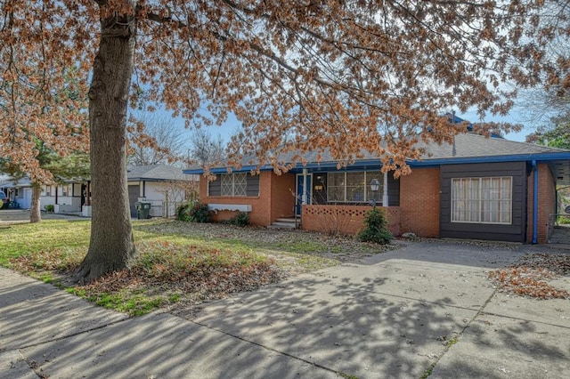 ranch-style house with a front lawn