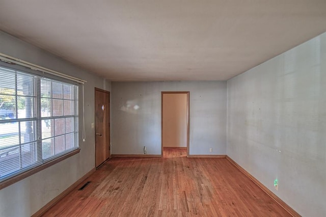 empty room with light wood-type flooring