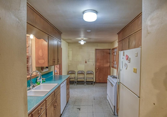 kitchen with sink and white appliances