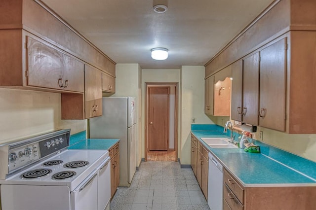 kitchen with sink and white appliances