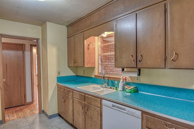 kitchen with sink and white dishwasher