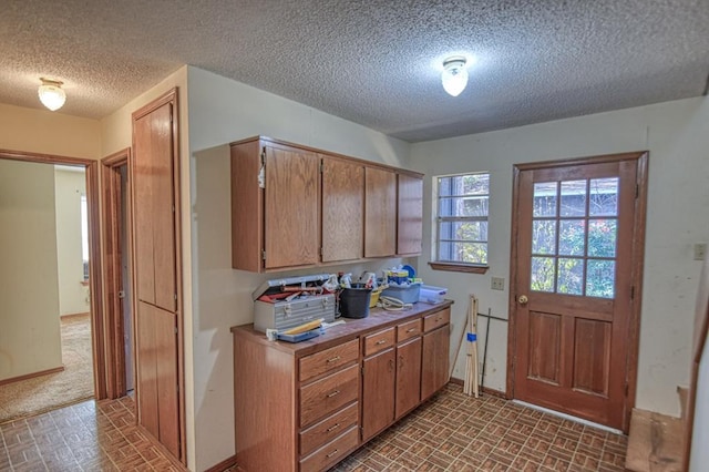 kitchen featuring a textured ceiling