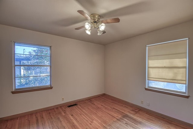 unfurnished room featuring light hardwood / wood-style floors and ceiling fan