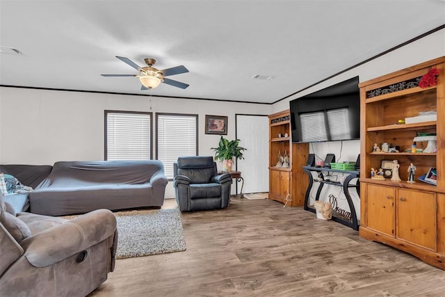 living room with ceiling fan and hardwood / wood-style floors