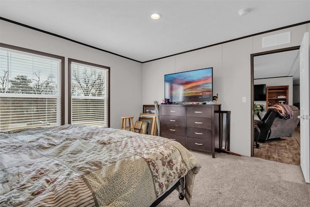 bedroom featuring carpet flooring and ornamental molding