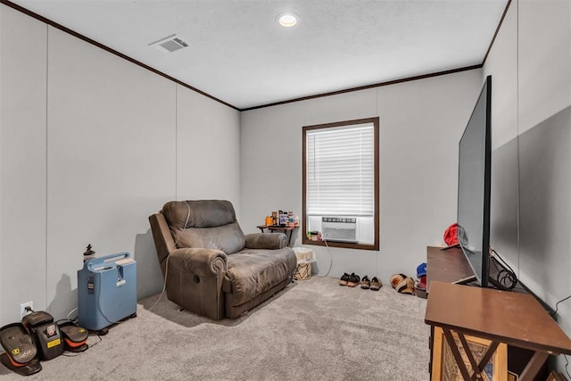 sitting room featuring crown molding, cooling unit, and carpet floors