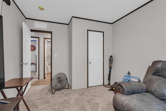 living area with light carpet and ornamental molding