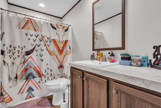 bathroom with toilet, ornamental molding, walk in shower, and vanity