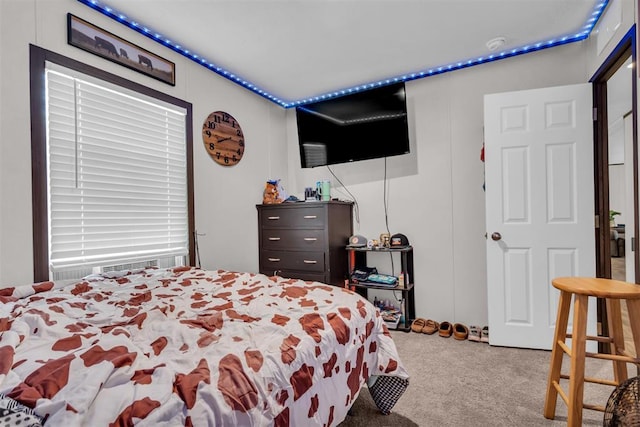 bedroom featuring cooling unit and carpet floors