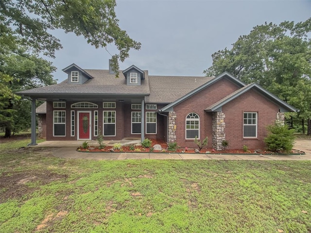 view of front of property with a front yard and a porch