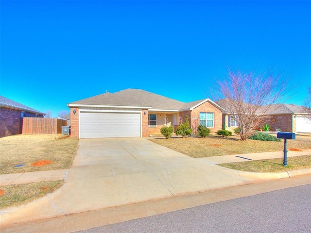 ranch-style home featuring a front lawn and a garage