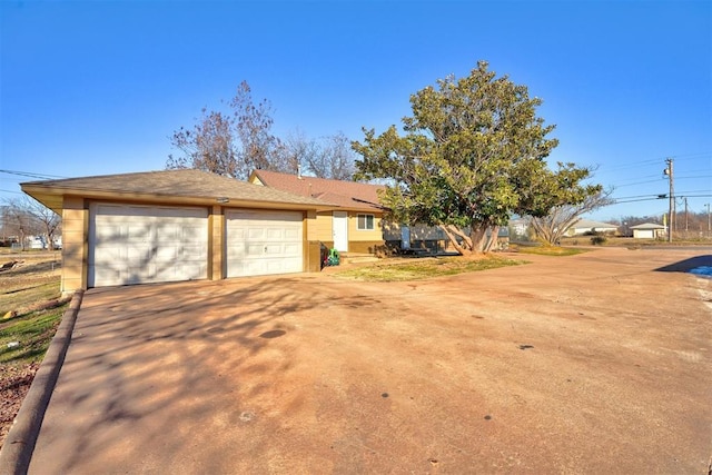 view of side of home featuring a garage