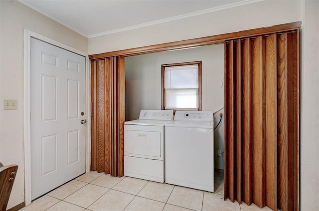 washroom featuring light tile patterned floors and separate washer and dryer