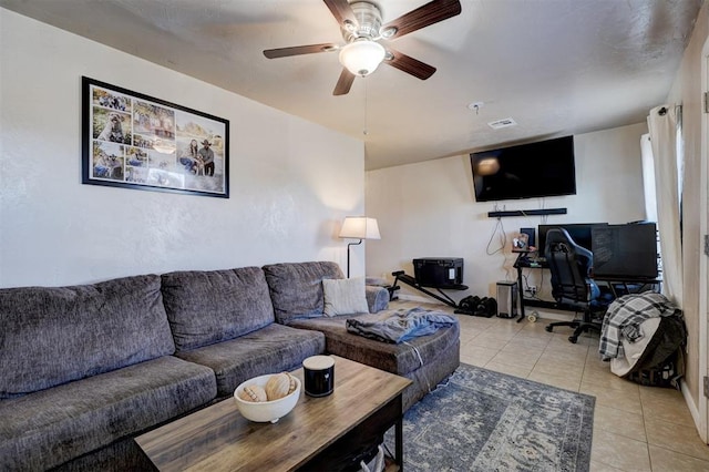 living room featuring ceiling fan and light tile patterned flooring