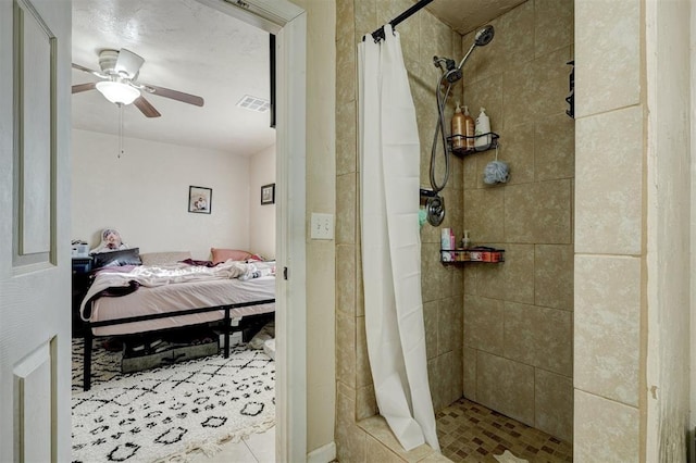 bathroom featuring ceiling fan and a shower with curtain