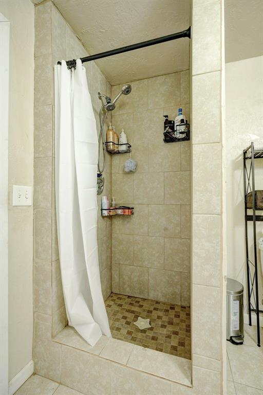 bathroom with a shower with shower curtain